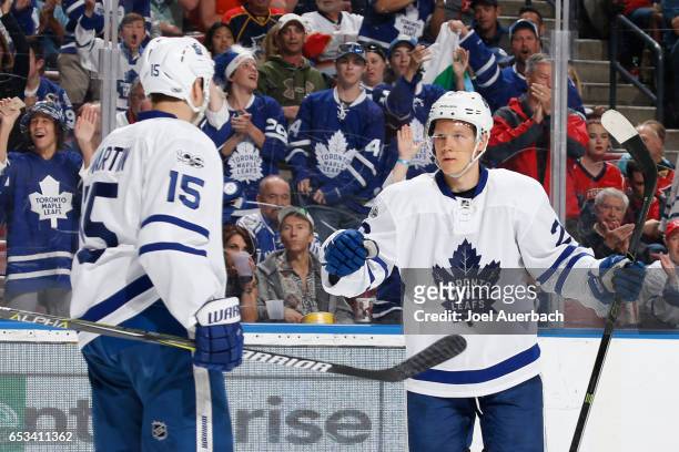 Nikita Soshnikov celebrates his second period goal with Matt Martin of the Toronto Maple Leafs against the Florida Panthers at the BB&T Center on...