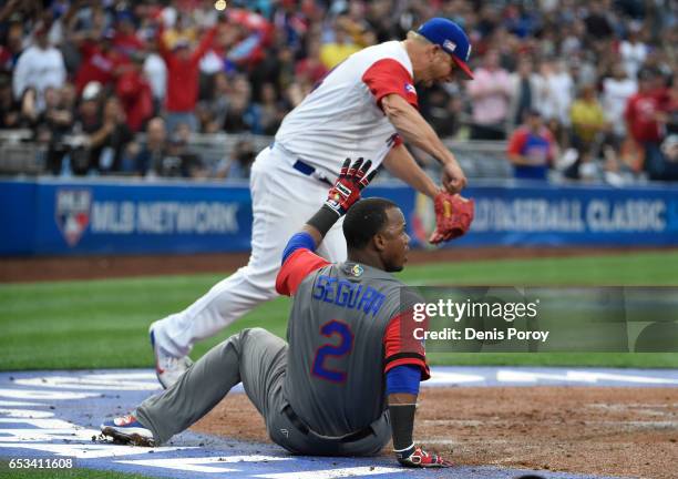 Orlando Roman of Puerto Rico reacts after Jean Segura of the Dominican Republic was tagged out at the plate during the first inning of World Baseball...