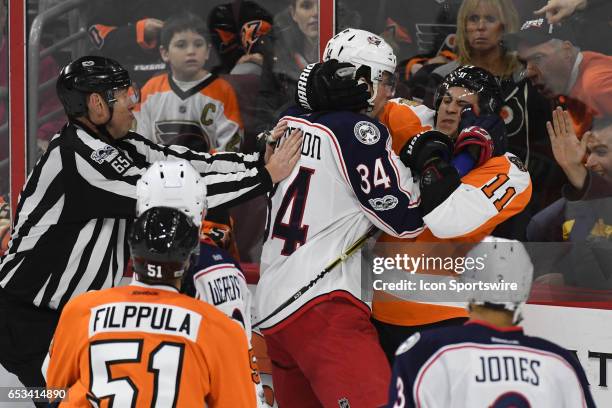 Philadelphia Flyers Winger Travis Konecny and Columbus Blue Jackets Right Wing Josh Anderson earn offsetting minors during a National Hockey League...