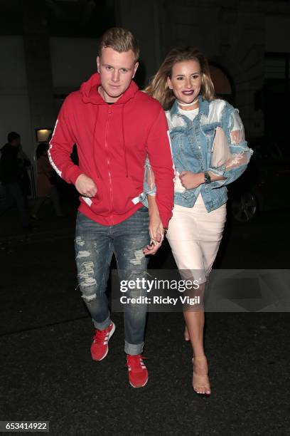 Georgia Kousoulou and Tommy Mallet on a night out leaving Nobu Berkeley St restaurant on March 14, 2017 in London, England.