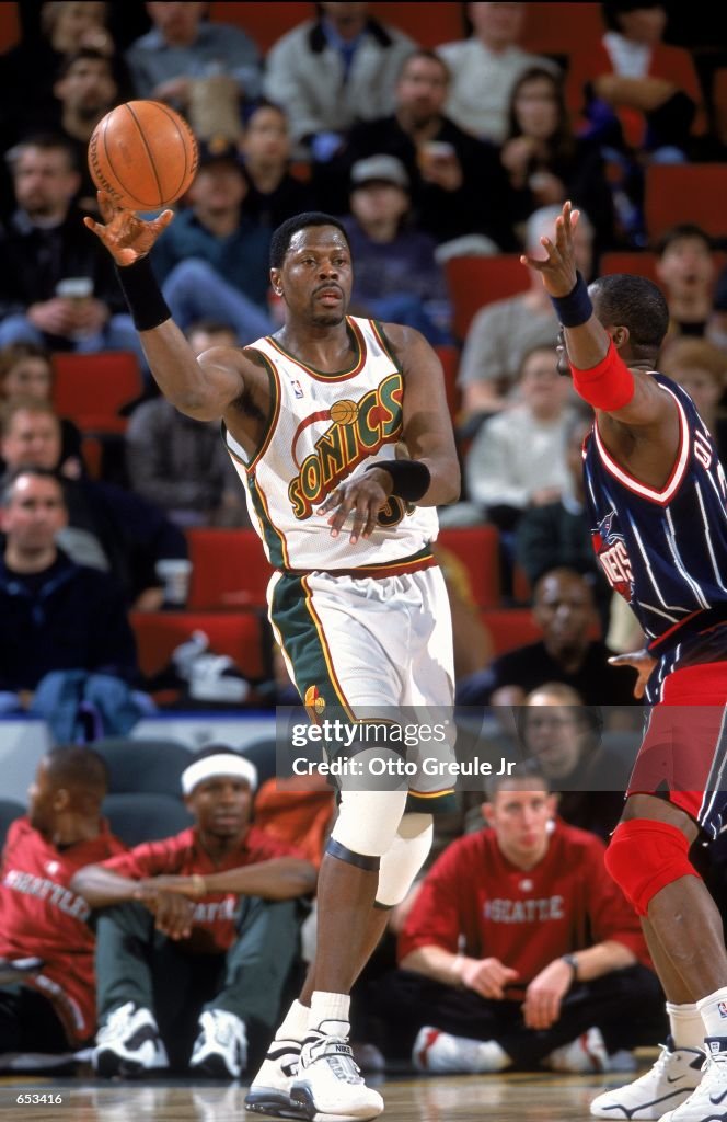 Patrick Ewing of the Seattle SuperSonics passes the ball during the ...