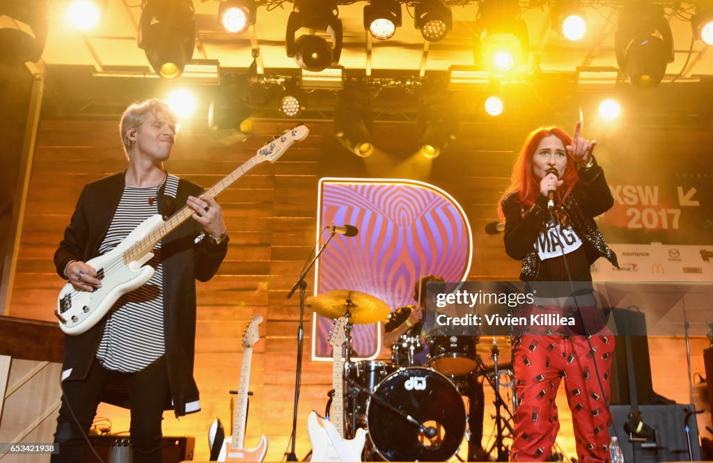 Mike Del Rio Musicians Mike Del Rio and Crista Ru of POWERS perform onstage during ...