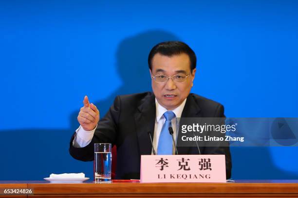 Chinese Premier Li Keqiang speaks during a press conference after the closing of the Fifth Session of the 12th National People's Congress at the...