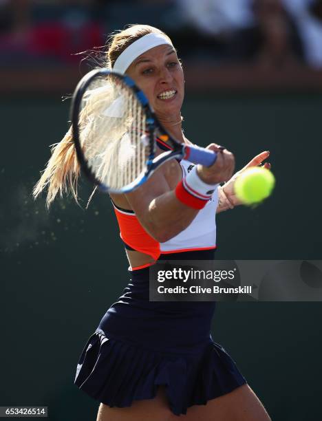 Dominika Cibulkova of Slovakia plays a forehand against Anastasia Pavlyuchenkova of Russia in their fourth round match during day nine of the BNP...