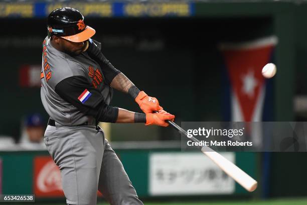 Infielder Yurendell de Caster of the Netherlands flies out in the top of the second inning during the World Baseball Classic Pool E Game Five between...