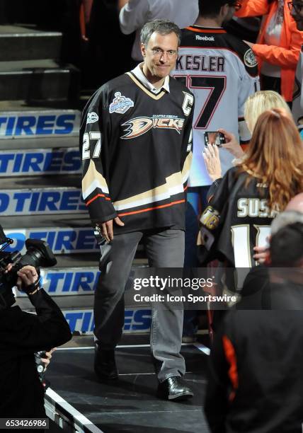 Former Anaheim Ducks player Scott Niedermayer heads for stage at center ice during ceremonies for the Ducks 10th Anniversary of their 2007 Stanley...