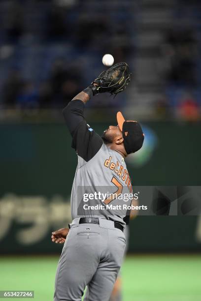 Infielder Yurendell de Caster of the Netherlands makes a catch a pop fly by Infielder William Saavedra of Cuba in the bottom of the second inning...