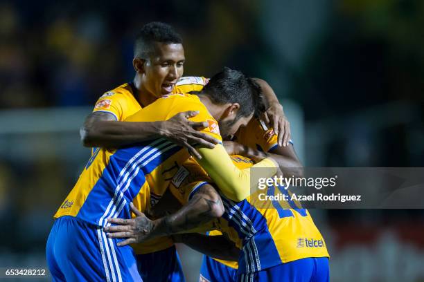 Eduardo Vargas of Tigres celebrates with teammates after scoring his team's second goal during the semifinals first leg match between Tigres UANL and...