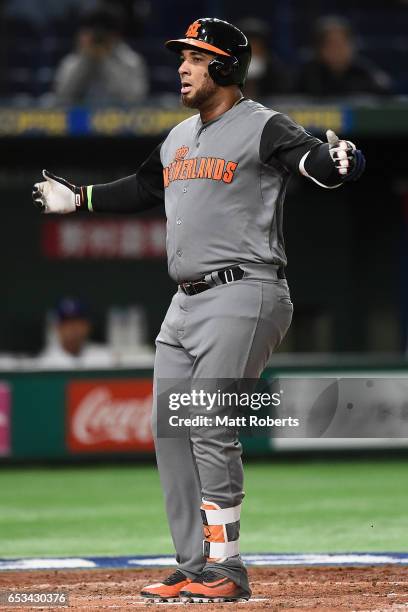 Outfielder Wladimir Balentien of the Netherlands celebrates after hitting a solo homer in the top of the third inning during the World Baseball...