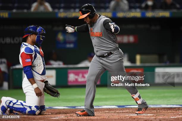 Outfielder Wladimir Balentien of the Netherlands celebrates after hitting a solo homer in the top of the third inning during the World Baseball...