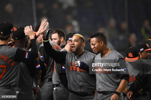 Outfielder Wladimir Balentien of the Netherlands celebrates with his team mates after hitting a solo homer to make it 5-0 in the top of the third...