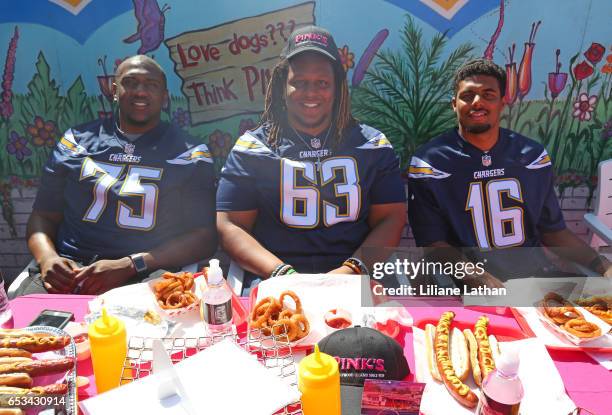 Guard Donavon Clark, tackle Chris Hairston and wide receiver Tyler Williams attend the unveiling of the "Chargers Chilli Cheese" at Pink's Hot Dogs...