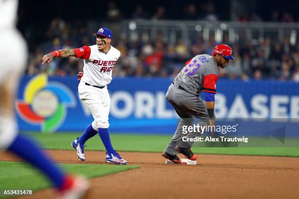 Javier Baez of Team Puerto Rico reacts after catching Nelson Cruz of Team Dominican Republic stealing in the eighth inning of Game 1 of Pool F of the...