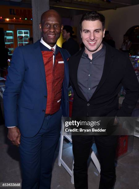 Dapper Dan and Airbnb CEO Brian Chesky attend Experience Harlem hosted by Airbnb and Ghetto Gastro on March 14, 2017 in New York City.