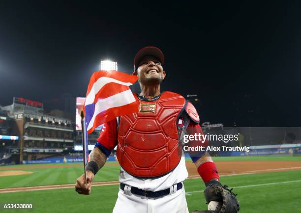 Yadier Molina of Team Puerto Rico celebrates after defeating Team Dominican Republic in Game 1 of Pool F of the 2017 World Baseball Classic on...