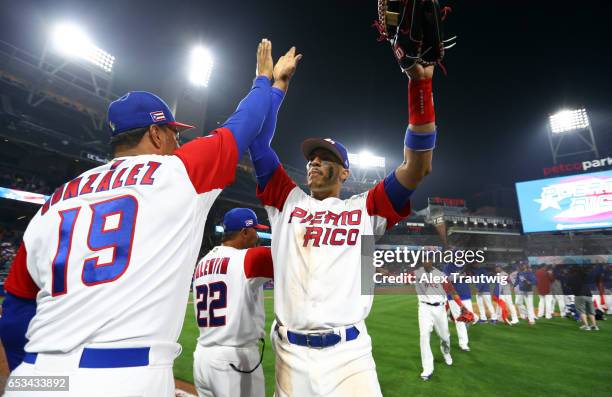 Carlos Correa of Team Puerto Rico celebrates after defeating Team Dominican Republic in Game 1 of Pool F of the 2017 World Baseball Classic on...