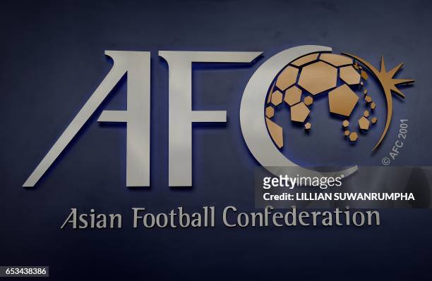 The Asian Football Confederation logo is displayed at the AFC headquarters in Kuala Lumpur on March 15, 2017. The upcoming AFC Asian Cup qualifier...