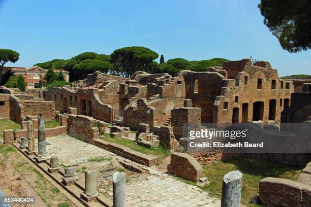 large insula apartment building, ancient roman harbor city of ostia antica - antica roma stock-fotos und bilder
