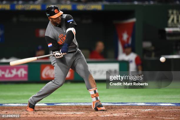 Outfielder Wladimir Balentien of the Netherlands hits a RBI single to make it 13-0 in the top of the fifth inning during the World Baseball Classic...
