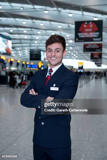 In this image released by British Airways today, March 15th 2017, in London, England, Tom Daley greets British Airways passengers at Heathrow T5 as...