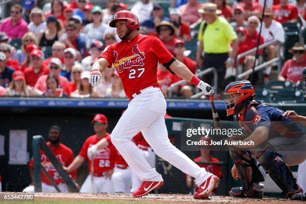 Jhonny Peralta of the St Louis Cardinals hits the ball against the Houston Astros in the first inning during a spring training game at Roger Dean...