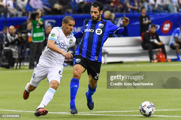 Forward Matteo Mancosu trying to stop Midfielder Osvaldo Alonso chasing the ball during the Seattle Sounders FC versus the Montreal Impact game on...