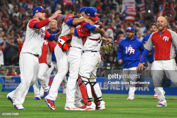 Puerto Rico Pitcher Edwin Diaz hugs Puerto Rico Catcher Yadier Molina after getting the save to end the game of a World Baseball Classic second round...