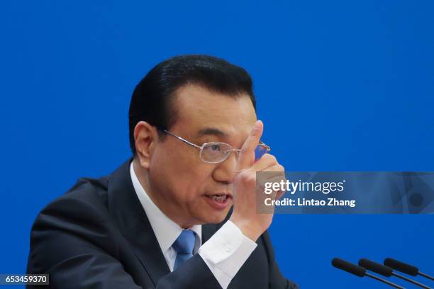 Chinese Premier Li Keqiang speaks during a press conference after the closing of the Fifth Session of the 12th National People's Congress at the...