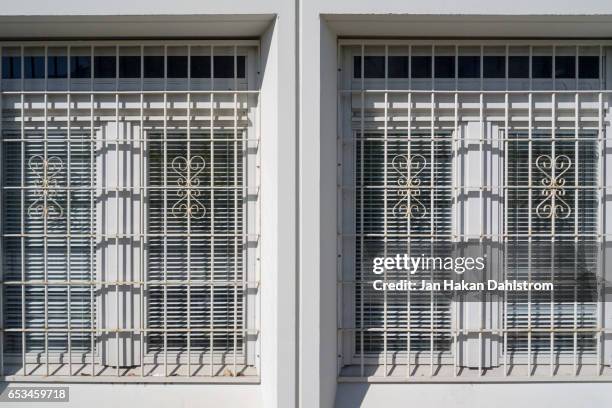 steel grid on window - sicherheitsgitter stock-fotos und bilder