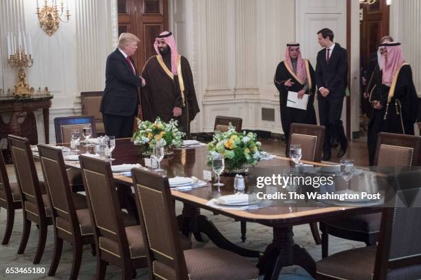 President Donald Trump and Saudi Defense Minister and Deputy Crown Prince Mohammed bin Salman bin Abdulaziz Al Saud shake hands as they arrive for...