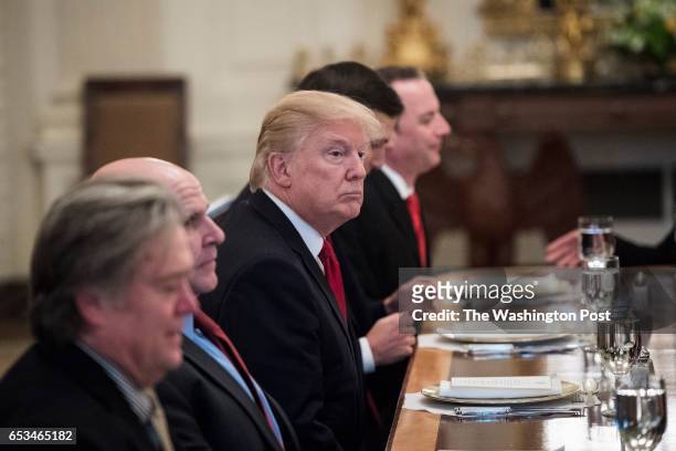 President Donald Trump sits for lunch with Saudi Defense Minister and Deputy Crown Prince Mohammed bin Salman bin Abdulaziz Al Saud in the State...