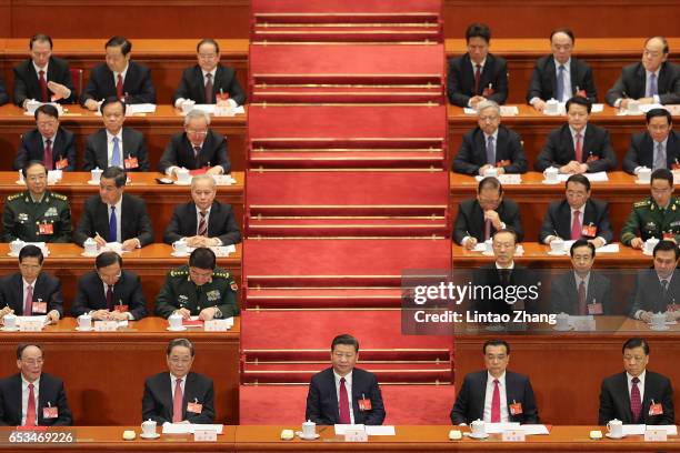 Chinese President Xi Jinping , Premier Li Keqiang and Chairman of the National Committee of the Chinese People's Political Consultative Conference Yu...