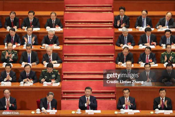 Chinese President Xi Jinping , Premier Li Keqiang and Chairman of the National Committee of the Chinese People's Political Consultative Conference Yu...