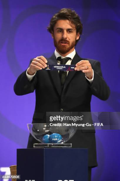 Pablo Aimar holds up the name of Venezuela during the draw for the FIFA U-20 World Cup Korea Republic 2017 at Suwon SK Artrium on March 15, 2017 in...