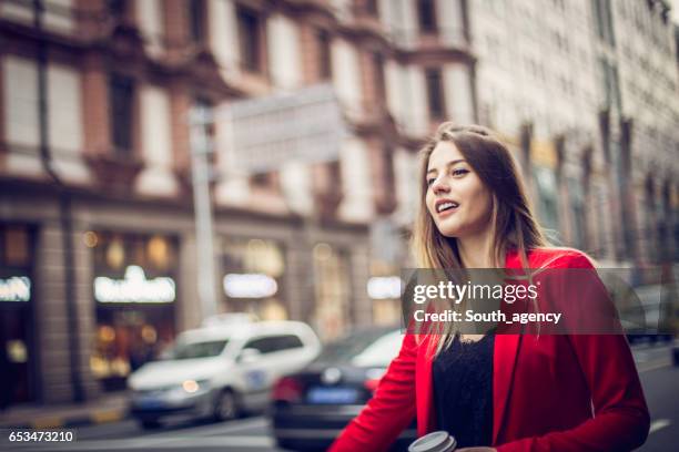 beautiful woman in red jacket - business woman in red suit jacket stock pictures, royalty-free photos & images