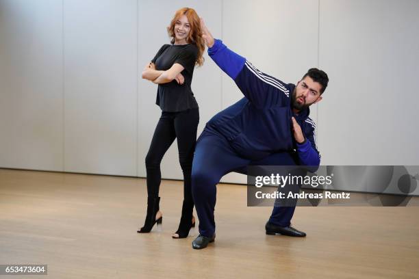 Comedian Faisal Kawusi and Oana Nechiti pose at a photo call for the tenth season of the television competition 'Let's Dance' on March 15, 2017 in...