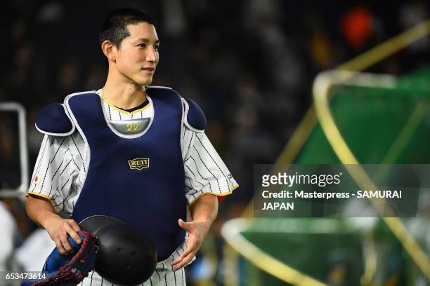 Catcher Seiji Kobayashi of Japan is seen prior to the World Baseball Classic Pool E Game Six between Israel and Japan at the Tokyo Dome on March 15,...