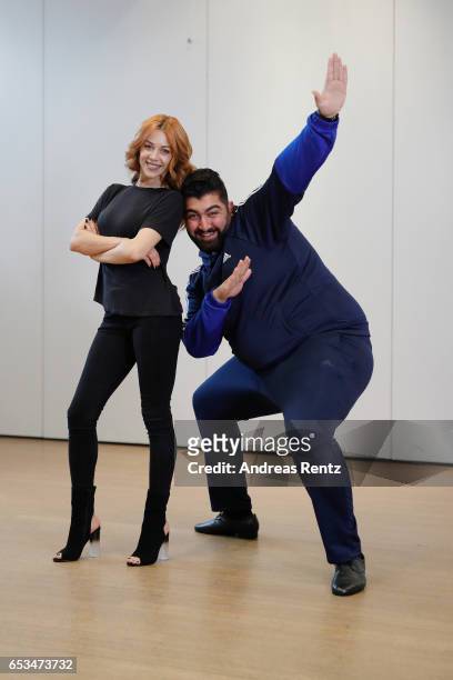 Comedian Faisal Kawusi and Oana Nechiti pose at a photo call for the tenth season of the television competition 'Let's Dance' on March 15, 2017 in...