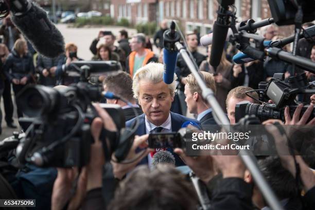 Geert Wilders , the leader of the right-wing Party for Freedom , speaks to the media after casting his vote during the Dutch general election, on...
