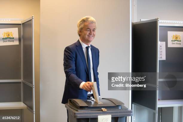 Geert Wilders, leader of the Dutch Freedom Party , casts his vote into a ballot box for the Dutch general election in The Hague, Netherlands, on...