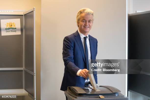 Geert Wilders, leader of the Dutch Freedom Party , casts his vote into a ballot box for the Dutch general election in The Hague, Netherlands, on...