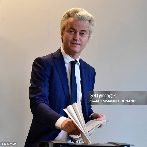 Netherlands' politician Geert Wilders of the Freedom Party casts his ballot for Dutch general elections at a polling station in The Hague on March...