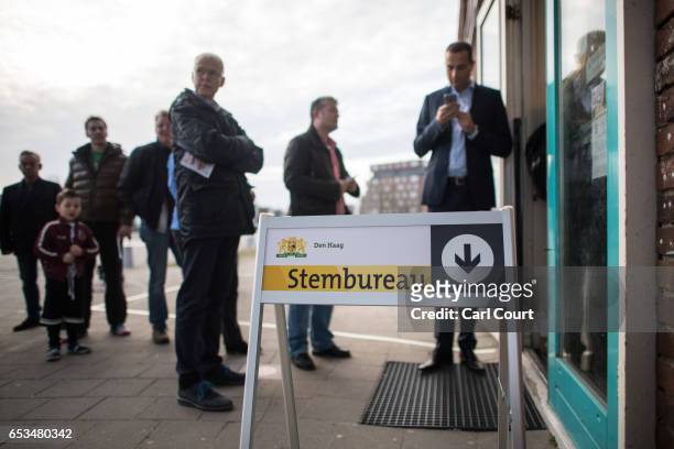 People queue to cast their vote in the Dutch general election, on March 15, 2017 in The Hague, Netherlands. Dutch voters go to the polls today in a...