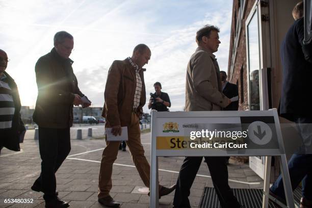 People queue to cast their vote in the Dutch general election, on March 15, 2017 in The Hague, Netherlands. Dutch voters go to the polls today in a...