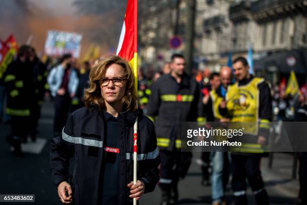A woman Firefighter during a demonstration of French firefighters against staff reductions in Paris on March 14, 2017.
