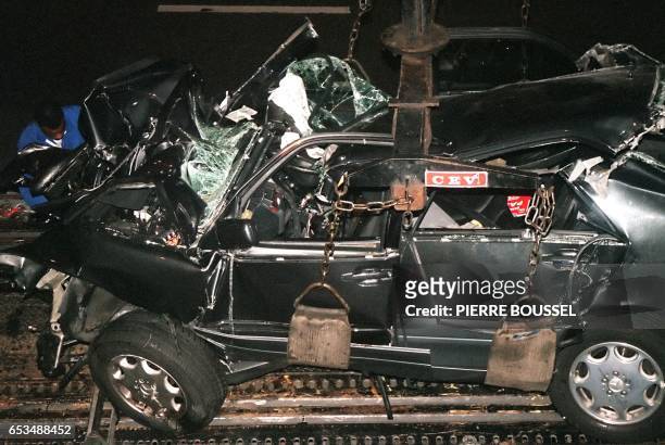 File photo dated 31 August 1997 shows a French police expert working on the wreckage of Princess Diana's car in the Alma tunnel of Paris. The father...