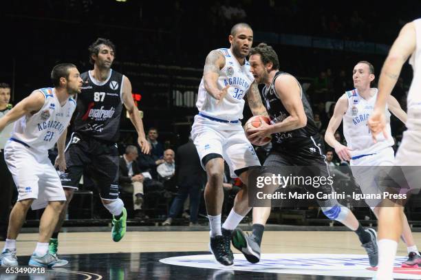 Guido Rosselli of Segafredo competes with Alessandro Piazza and Damen Bell Holter and Marco Evangelisti of Moncada during the quarter of final match...