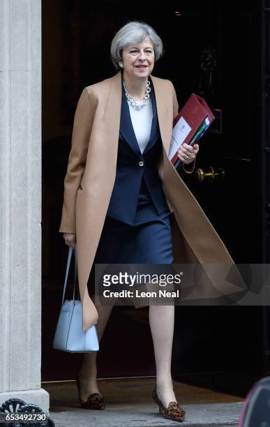 British Prime Minister Theresa May leaves number 10, Downing Street ahead of the weekly PMQ session in the House of Commons on March 15, 2017 in...