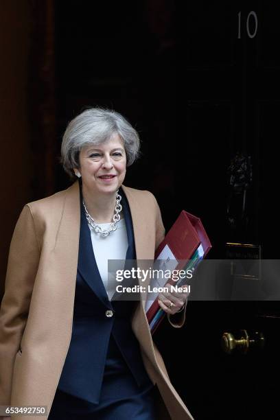 British Prime Minister Theresa May leaves number 10, Downing Street ahead of the weekly PMQ session in the House of Commons on March 15, 2017 in...