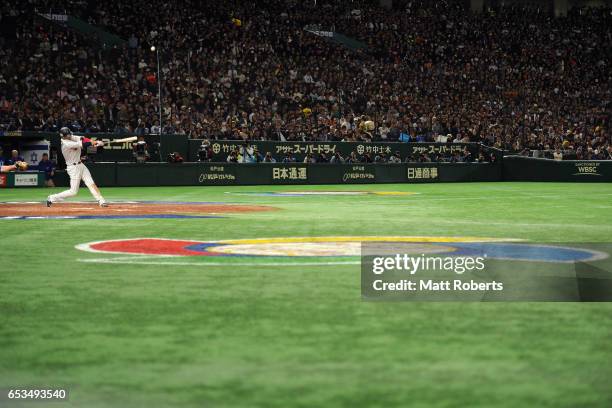 Infielder Hayato Sakamoto of Japan pops out in the bottom of the fourth inning during the World Baseball Classic Pool E Game Six between Israel and...